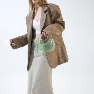 Detail of mint green acrylic hobo bag featuring a unique 3D bubble textured surface