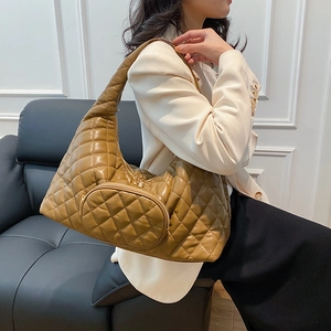 Brown quilted PU leather crescent shoulder bag with a matching small round coin purse