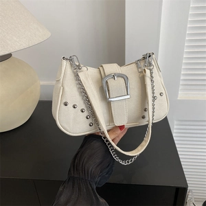 Retro cream canvas underarm bag with large silver buckle and metal chain strap