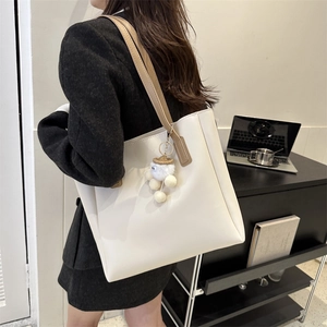 Minimalist cream white PU leather crossbody tote bag with cute bear charm for daily commute
