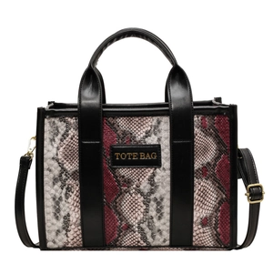 Chic snakeskin print tote bag with black leather handles and crossbody strap