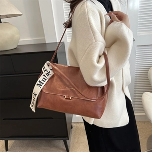 Retro brown leather crossbody bag with gold buckle and decorative silk scarf for women