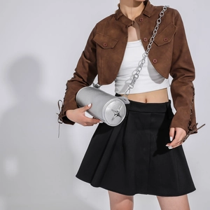 Silver cylindrical crossbody bag with metallic finish and star charm on chain strap
