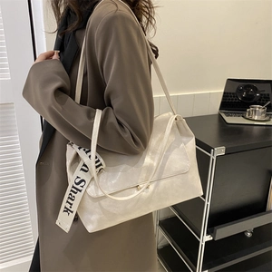Minimalist cream white PU crossbody bag with unique Shark lettered woven shoulder strap