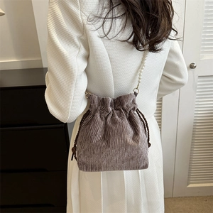Women's pleated velvet bucket bag in mauve with elegant pearl beads shoulder strap