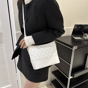 Chic white quilted PU leather crossbody bag with adjustable gold hardware for women