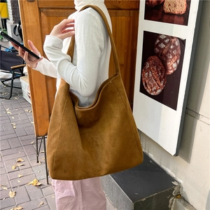 Brown suede tote bag for women featuring a large capacity and minimalist shoulder design