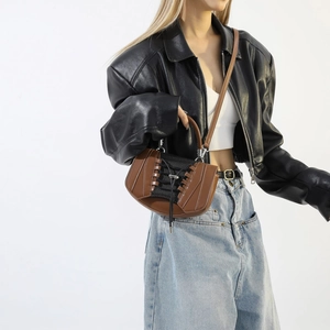 Chic two-tone brown PU leather handbag with corset-style lace-up detail on model