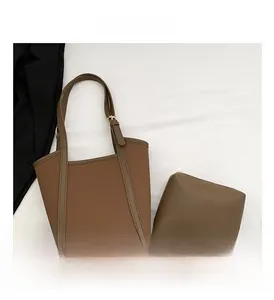 Brown leather tote bag set including a large shoulder bag and small matching zip pouch