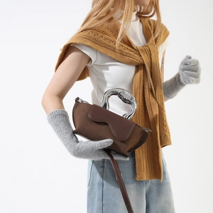 Minimalist brown suede crossbody bag with a unique silver fluid metal handle for women