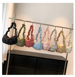 Detailed grid view of cloud-shaped pleated bags in eight various fashion colors