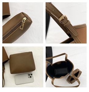 Detail view of dark brown bucket bag set with golden hardware and inner zip pouch