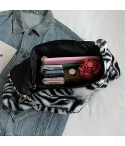 Detail view of plush zebra print tote showing spacious interior for daily essentials