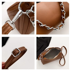 Detailed views of brown pebble leather texture, silver hardware and interior of the bag