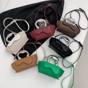 Top-down view of stylish handbags with unique silver metal handles in six trendy colors