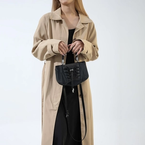 Minimalist black PU leather handbag with corset-style lace-up detail and silver metal handle