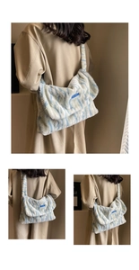 Detailed close-up of blue zebra pattern plush shoulder bag with soft faux fur texture