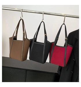 Detailed display of three minimalist PU leather tote bags in coffee, black and rose red