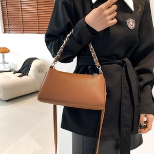 Minimalist caramel brown PU leather baguette bag with silver chain and long shoulder strap