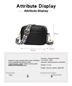 Detail view of black lychee leather crossbody camera bag with geometric woven strap
