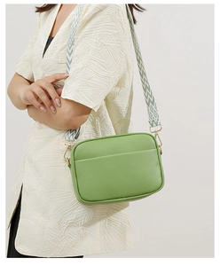 Grass green camera bag with lychee grain leather and geometric patterned strap