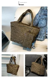 Detail view of brown quilted tote bag set with matching pouch in lifestyle settings