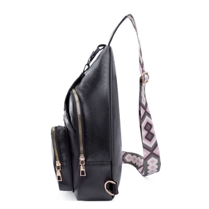 Detail of black PU leather crossbody bag with stylish geometric pattern woven strap