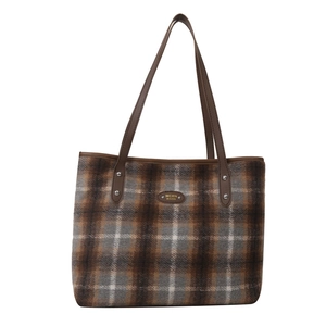 French retro plaid tote bag with brown leather shoulder straps and metal logo plate