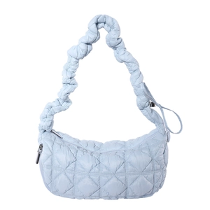 Quilted light blue hobo bag with cloud-style pleated shoulder strap in a minimalist design