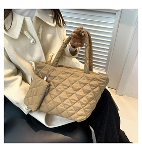 Close-up of quilted cotton tote bag in khaki with matching small zippered coin pouch