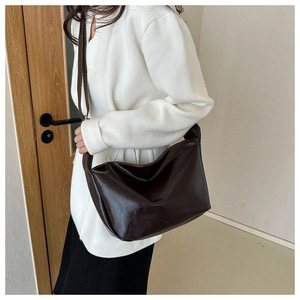 Minimalist dark brown soft PU leather tote bag shown on shoulder for daily retro style