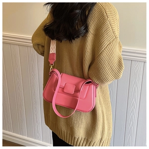 Pink PU leather shoulder bag featuring a geometric strap and minimalist buckle detail