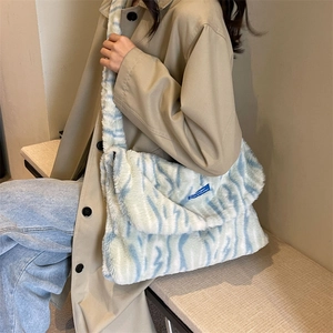 Winter plush tote bag with light blue zebra stripes for women casual crossbody style