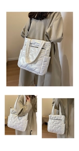 Detailed view of the white quilted tote bag featuring pearl luster fabric and straps