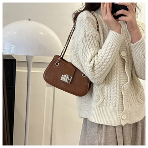 Brown crocodile embossed leather shoulder bag with silver clasp and metal chain strap