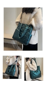 Detail of dark green quilted crossbody bag featuring glossy nylon and wide strap