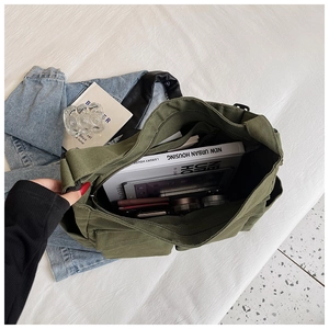 Detail view of military green canvas tote interior with large capacity and zipper pocket