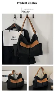 Close-up of black and brown canvas tote bag with functional double front pockets