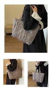 Detailed macro view of taupe quilted tote bag featuring elegant diamond stitching pattern