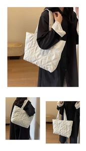 Detail of white quilted tote bag with diamond pattern and soft faux leather texture
