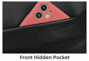 Close-up of front hidden pocket on black pebble leather bag with smartphone inside