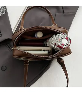Interior view of brown PU leather shoulder bag showing spacious storage for daily essentials