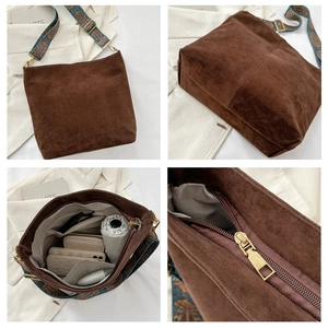 Brown faux suede crossbody bag with bohemian wide strap showing interior storage capacity