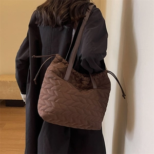 Quilted dark brown tote bag with V-shaped stitching and drawstring for women
