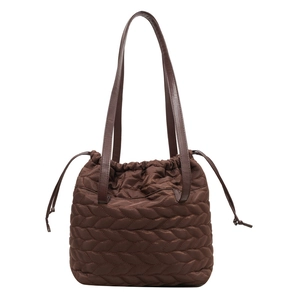 Deep brown quilted nylon shoulder bag with ear-shaped stitching and drawstring closure