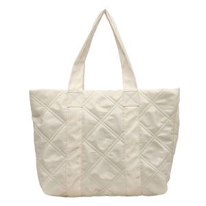 Minimalist beige quilted tote bag with diamond stitching and reinforced handles