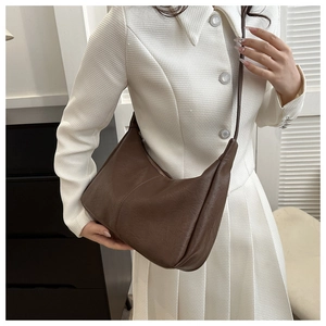 Detail view of deep brown hobo shoulder bag with textured PU leather and zipper closure