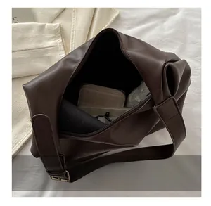Top view of deep brown PU leather tote bag interior showing large storage capacity