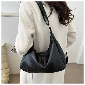 Macro view of the retro black PU leather hobo bag showing shoulder strap and gold ring detail