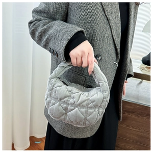 Chic light gray quilted bubble handbag with a soft cloud-like puff texture and zipper